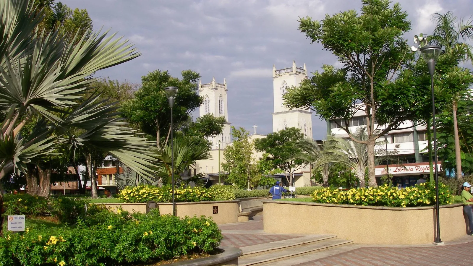 Central plaza with gardens and church towers in David, Chiriquí